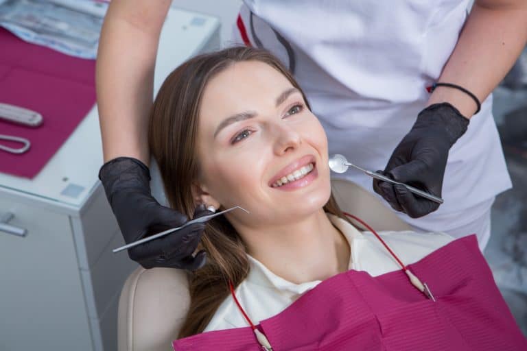 dentist-examining-teeth-young-woman-patient-dental-clinic-dentistry-concept